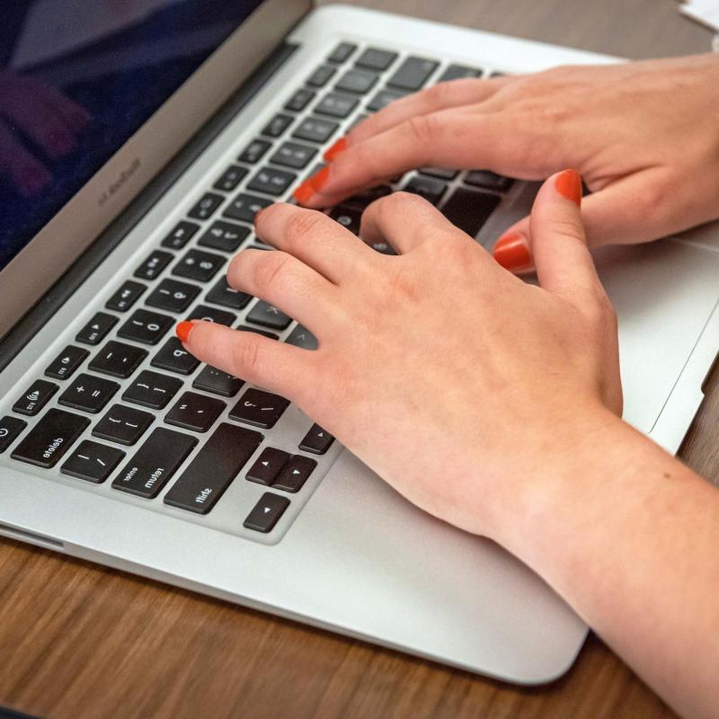 Closeup of hands on a keyboard 